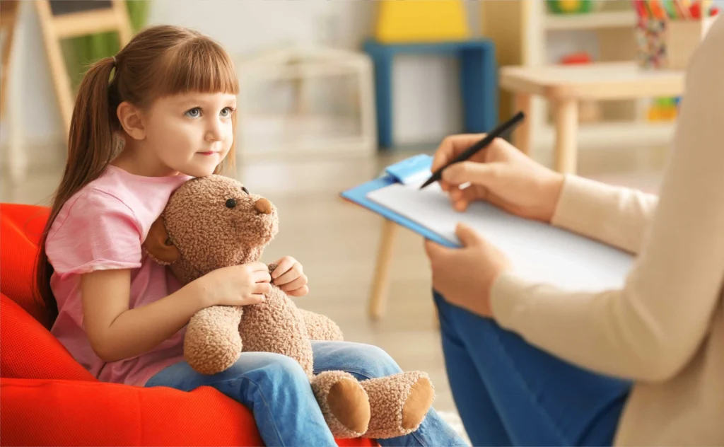A child and family participating in a behavioral health visit