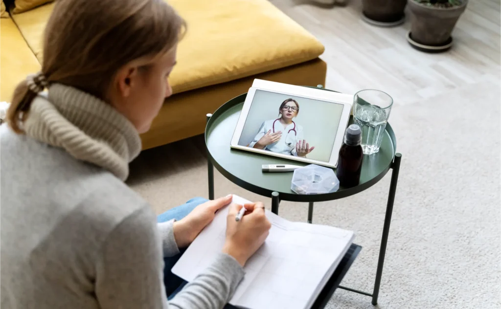 A patient participating in a telehealth psychiatry appointment