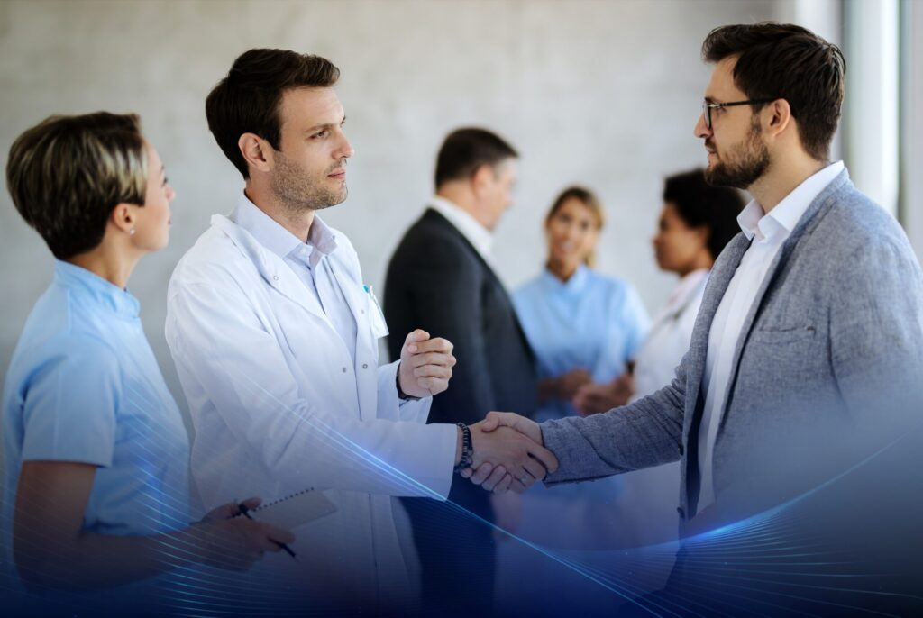 A clinician speaking with a patient in a clinical setting
